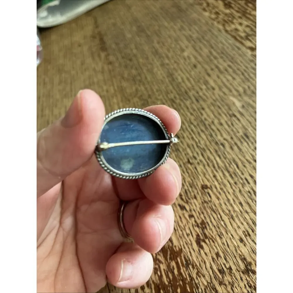A Vintage Navajo Sterling Silver Sand Cast Brooch With A Lapis Cabochon